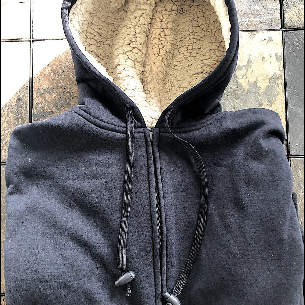 Navy blue zip-up hoodie sweatshirt with faux sheepskin lined hood. NWOT